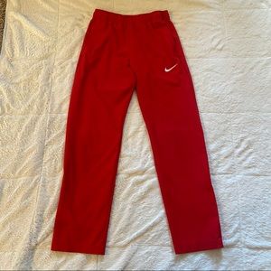 Nike Dri-Fit retro red drawstring sweatpants with zipper near ankle